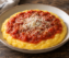 Polenta cremosa con tuco